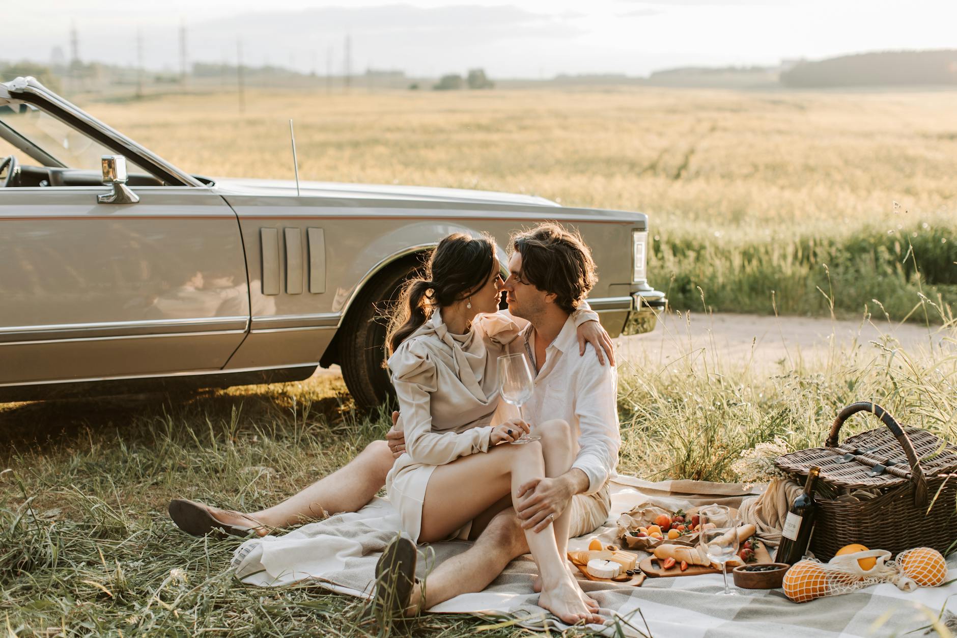 a romantic couple sitting on a grassy field things to look for when dating a masculine man, signs of a masculine man, how to know if he’s husband material, masculine man traits, feminine woman dating tips, what to look for in a man for marriage, masculine vs feminine energy in relationships, dating advice for women, high value man qualities, relationship red flags, masculine energy signs, dating masculine men, wife material tips, feminine energy attraction, marriage advice for women, qualities of a good husband, strong masculine man traits