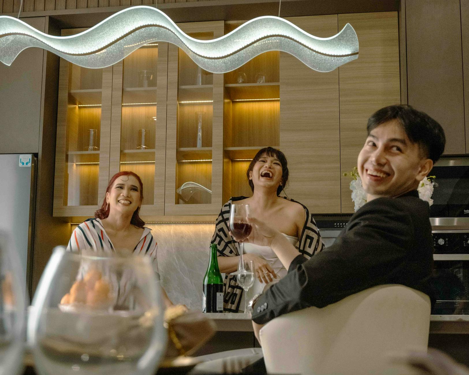 lively gathering in modern jakarta kitchen