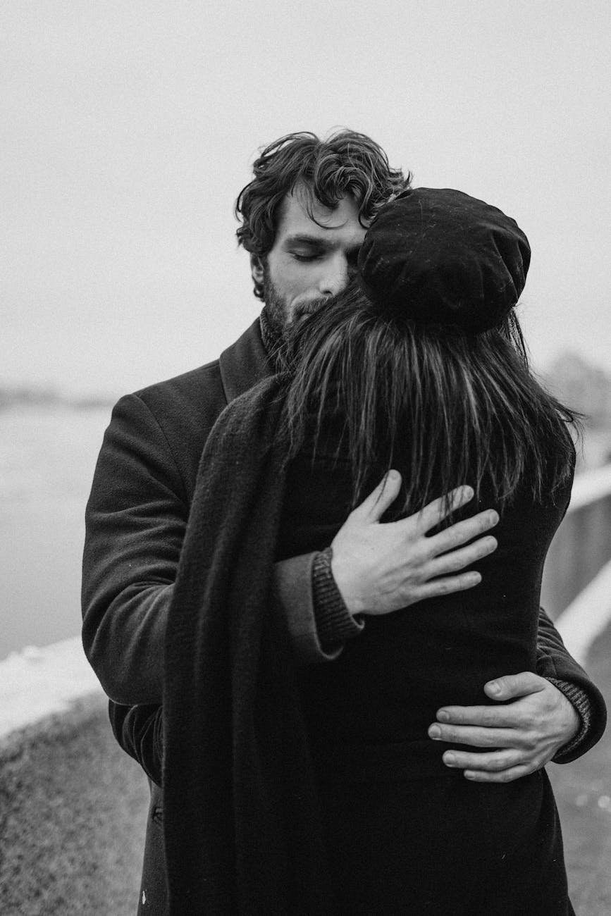man and woman hugging each other