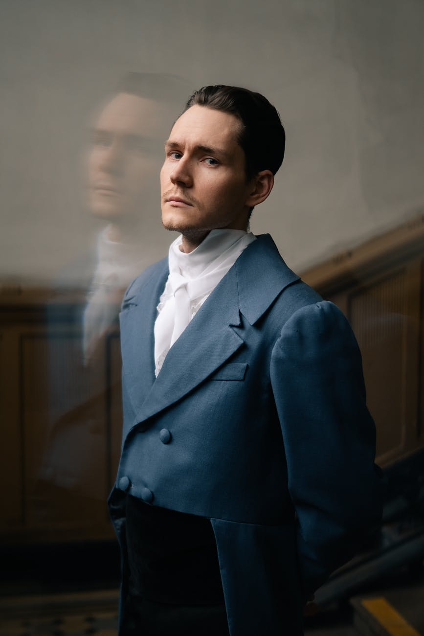 elegant portrait of man in vintage blue suit dating high-value men, financially struggling man, self-made man vs daddy’s boy, dating advice for women, spotting ambition in men, evaluating character in relationships, high-value provider types, relationship tips for women, navigating dating a provider, dating smart, love over money, choosing the right partner, setting boundaries in relationships, mutual growth in dating, building legacy with partner, high-value relationships guide, dating men with potential, understanding provider types, wealth vs character in dating, It Girl School dating advice